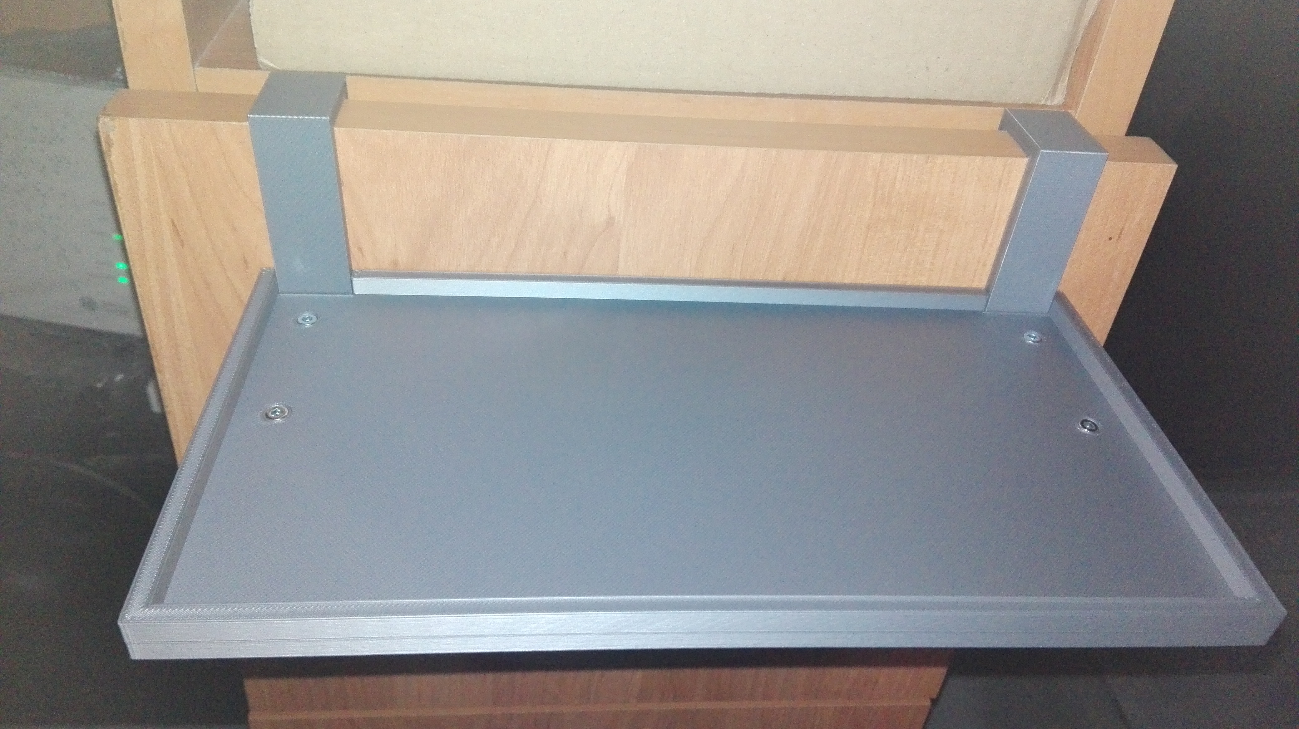 Small hanging shelf for a modem/router