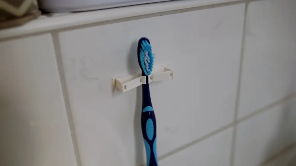 Compliant mechanism toothbrush holder - photo 4