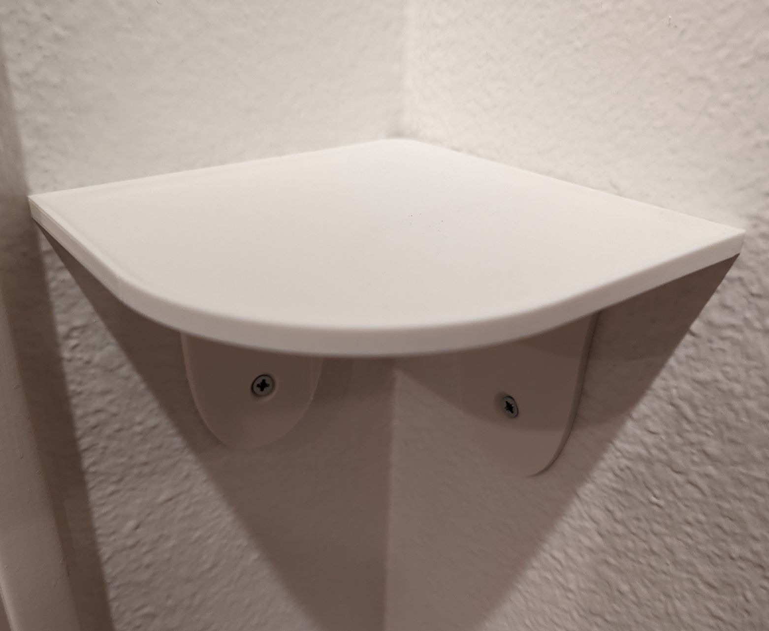 Rounded small corner shelf