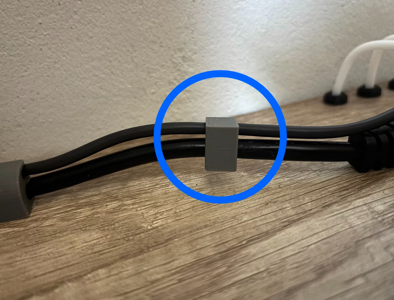 Cable clip for one large and one small cable