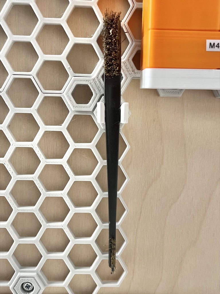 Honeycomb storage wall (HCW) brush holder