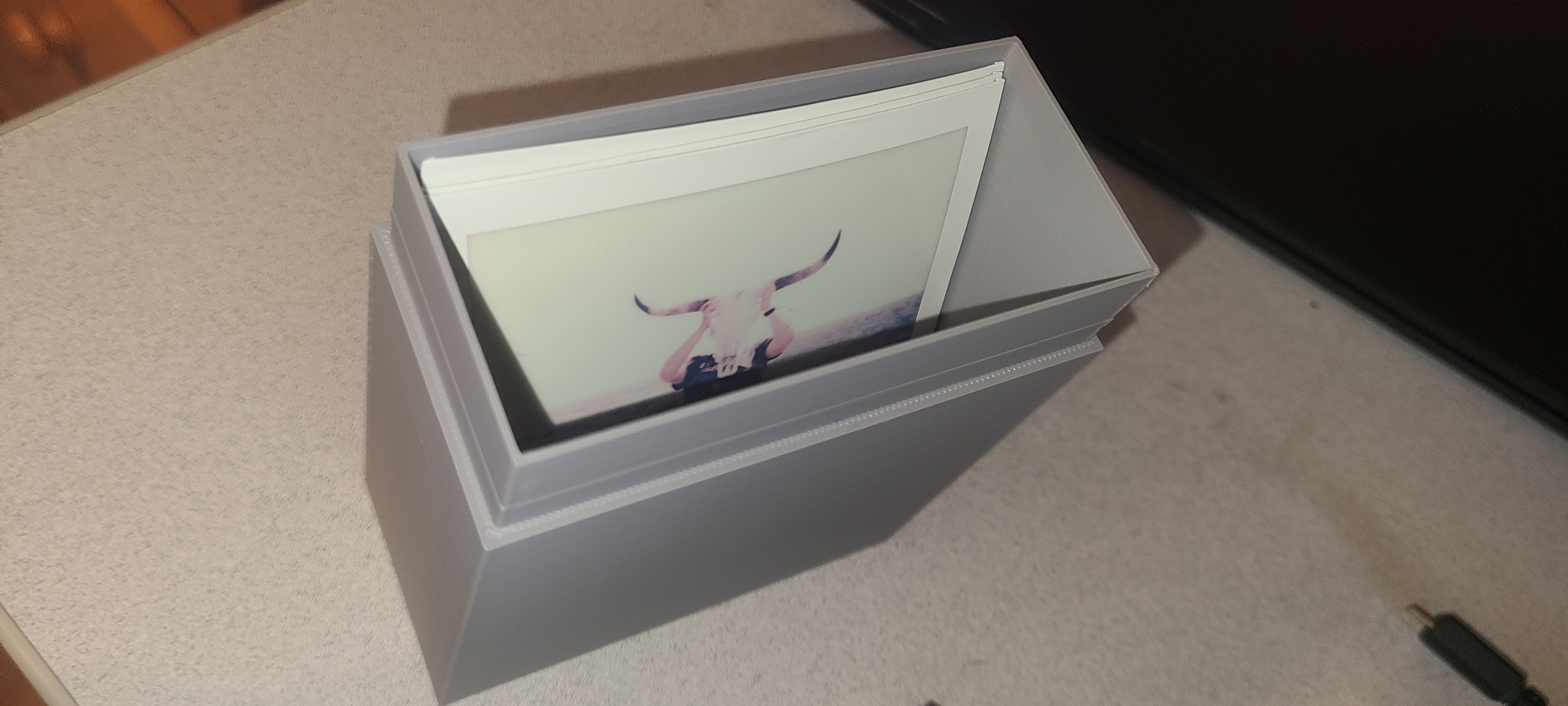 Polaroid photo storage box.