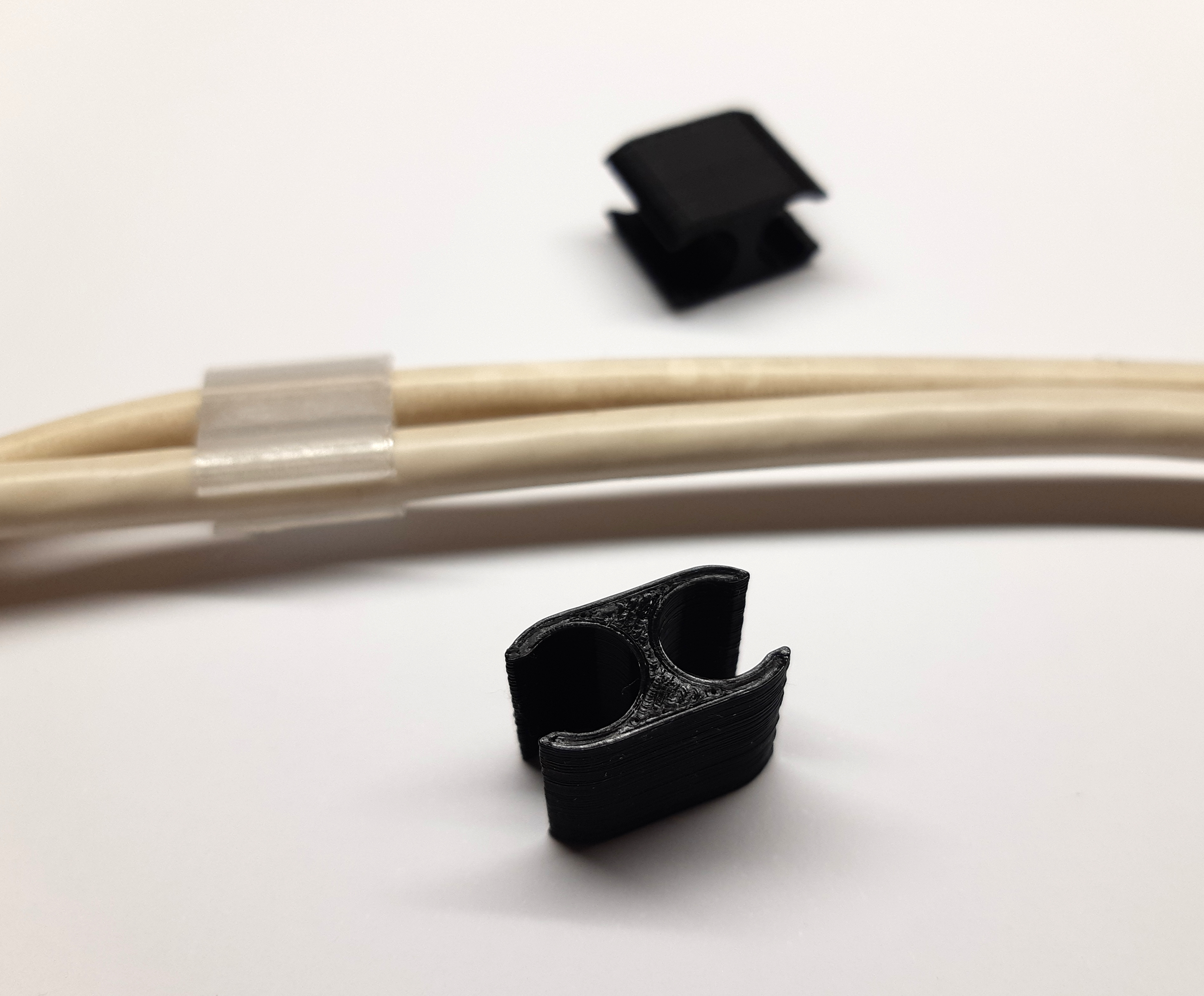 Cable clip: holds two cables together