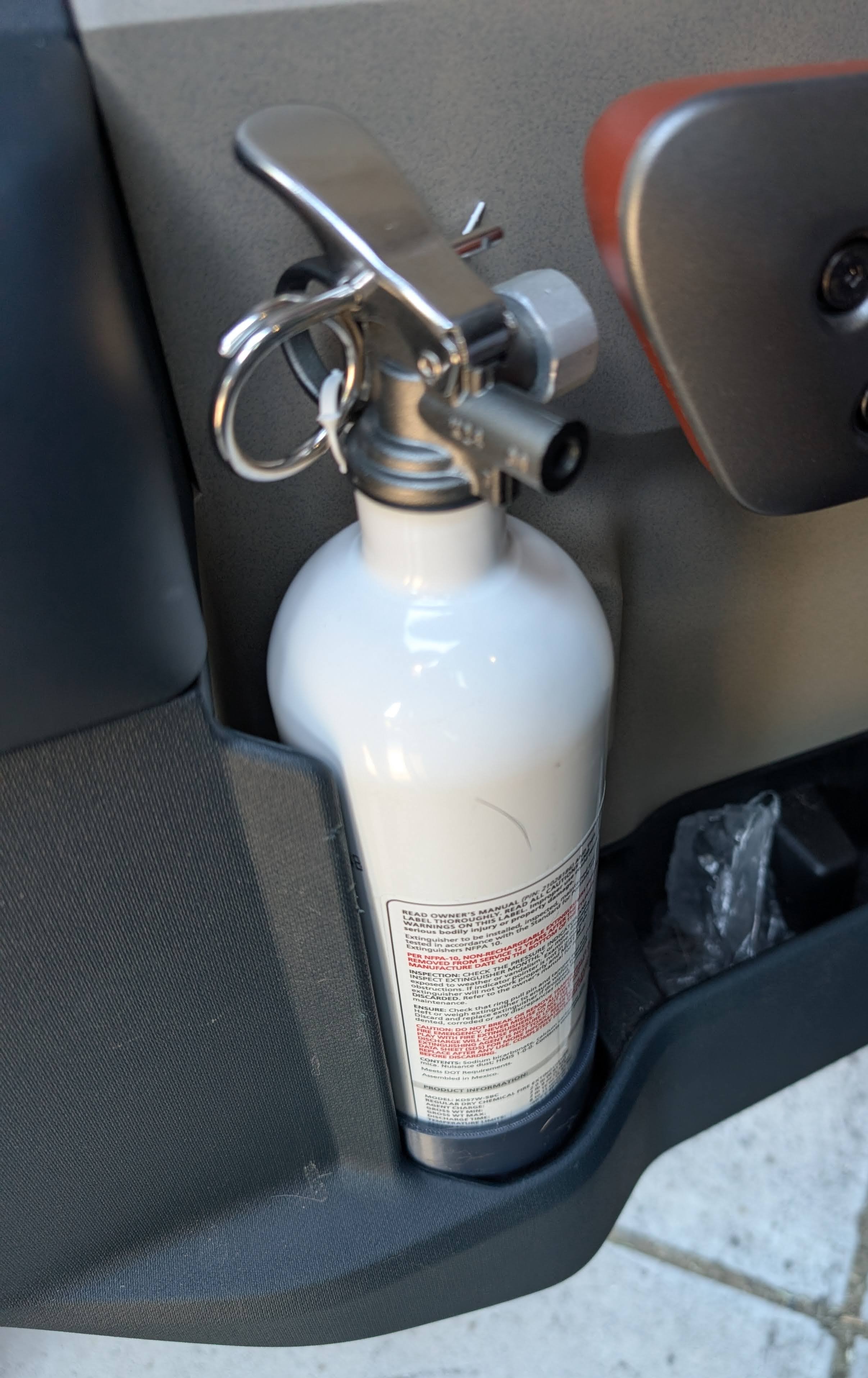 Sleeve for Kidde 21028230 extinguisher to mount in Ford Maverick rear door bottle holder